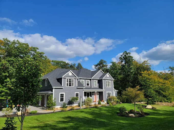 A Spacious House With A Big Yard And Trees