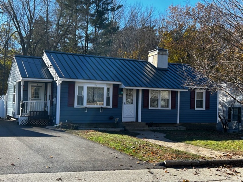 A Blue House With A Blue Roof